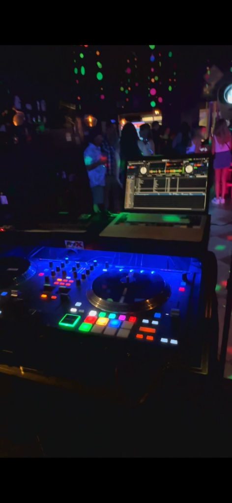 Private event stage and sound equipment at The Salty Zebra Bistro Jupiter Florida - DJ setup with colorful lights for late-night buyouts