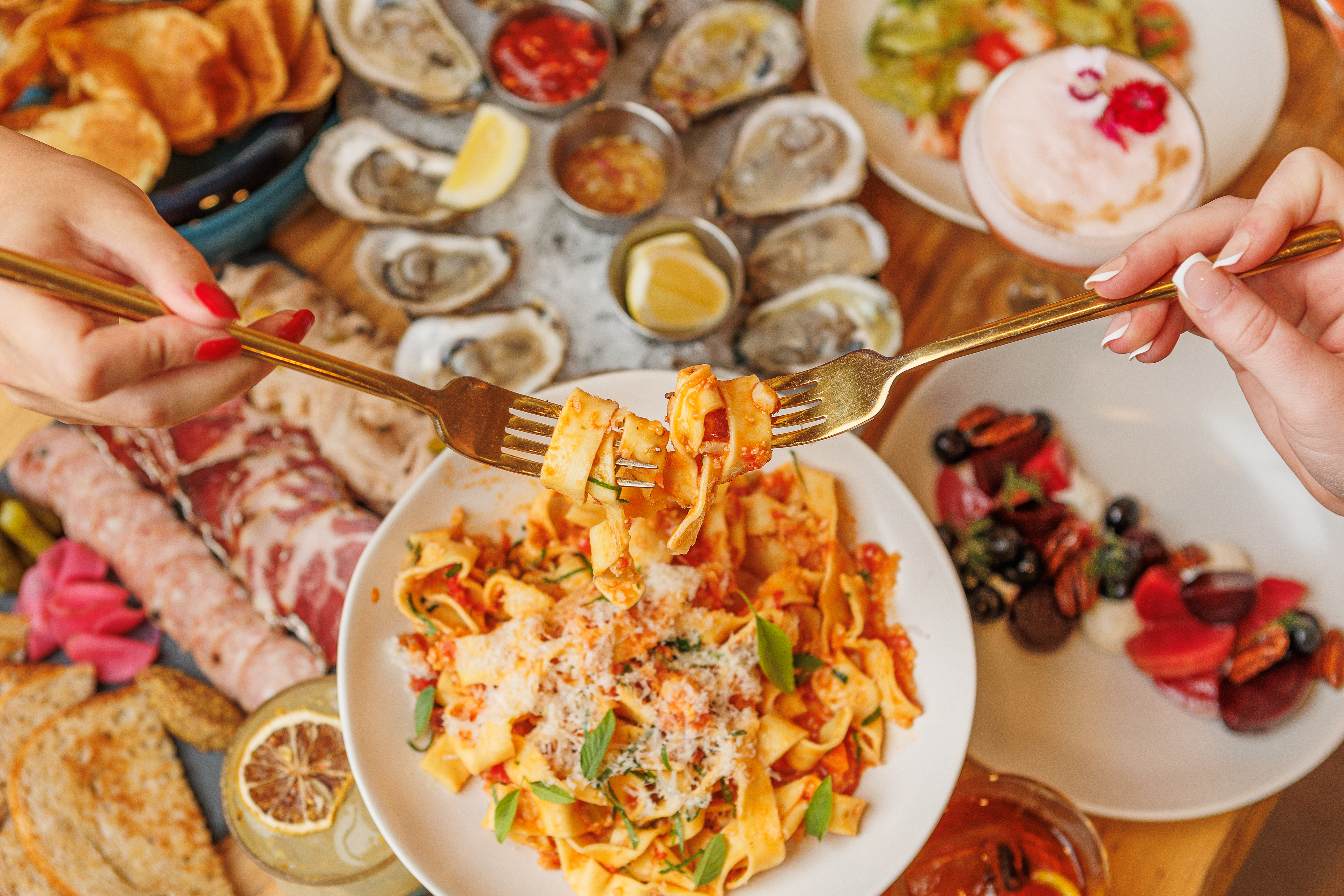 Summer menu spread at The Salty Zebra Bistro Jupiter FL — handmade pasta, oysters, and charcuterie